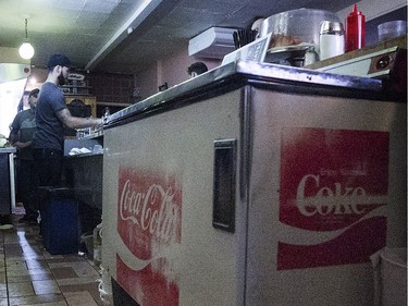 The old Coke refrigerator sits at the back of the counter at Moe's-Casse-Croute-du-Coin Friday, December 4, 2015. The 24-hour greasy spoon is set to close Monday, December 7, 2015 after, first Bessie Thomas, then the current owner, her son Eddy Thomas, failed to find a buyer. (Pierre Obendrauf / MONTREAL GAZETTE)