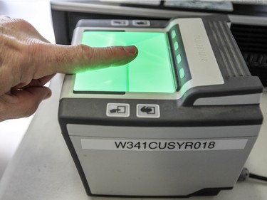 Journalists are given a tour of the arrivals centre for refugees arriving in Canada, at Trudeau Airport in Montreal Tuesday December 8, 2015. Fingerprint scanners will be in use as refugees are processed before being shuttled to a welcome centre in the St. Laurent borough.