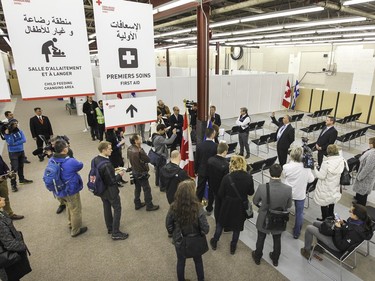 Journalists are given a tour of the welcome center for refugees arriving in Canada, in Montreal Tuesday Dec. 8, 2015.  After arriving at Trudeau airport, refugees will be brought to this warehouse in the St-Laurent borough where they will be united with their welcoming families.