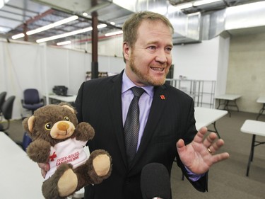 Pascal Mathieu, Vice-President of the Canadian Red Cross in Quebec holds a stuffed animal during tour of the welcome centre in the St. Laurent borough for refugees arriving in Canada, in Montreal Tuesday December 8, 2015.