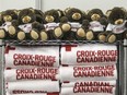 Stuffed bears and blankets sit on shelves ready to be given to Syrian refugees in the Canadian Red Cross section of the refugees welcome centre in St-Laurent after their arrival at Trudeau airport on Saturday, Dec. 12, 2015.