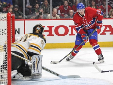Montreal Canadiens Christian Thomas looks to pass the puck in front of Boston Bruins Tuuka Rask during first period of National Hockey League game in Montreal Wednesday December 9, 2015.