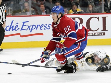 Montreal Canadiens Dale Weise is tripped by Boston Bruins Dennis Seidenberg during third period of National Hockey League game in Montreal Wednesday December 9, 2015. Seidenberg was penalized on the play.