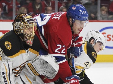 Montreal Canadiens Dale Weise fights for position between Boston Bruins goalie Tuuka Rask and defenceman Torey Krug, right, during third period of National Hockey League game in Montreal Wednesday December 9, 2015.