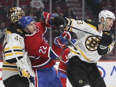 Montreal Canadiens Dale Weise, centre, is shoved by Boston Bruins defenceman Zdeno Chara in front of goalie Tuuka Rask during third period of National Hockey League game in Montreal Wednesday December 9, 2015.