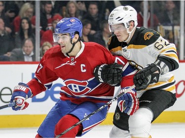 Montreal Canadiens Max Pacioretty is slowed down by Boston Bruins Zach Trotman during first period of National Hockey League game in Montreal Wednesday December 9, 2015.