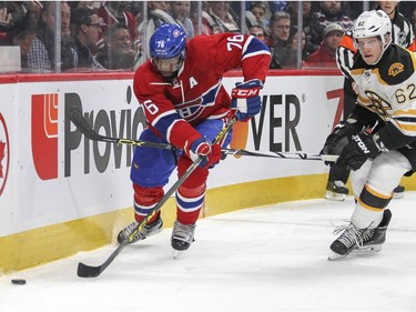 Montreal Canadiens P.K. Subban has Boston Bruins Zach Trotman's stick between his legs as he pursues the puck during first period of National Hockey League game in Montreal Wednesday December 9, 2015.