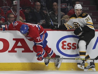 Montreal Canadiens P.K. Subban is knocked off balance by Boston Bruins Zac Rinaldo during second period of National Hockey League game in Montreal Wednesday December 9, 2015.