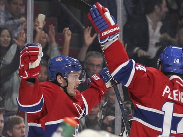 Montreal Canadiens Paul Byron, left, celebrates his goal with teammate Tomas Plekanec during first period of National Hockey League game against the Boston Bruins in Montreal Wednesday December 9, 2015.