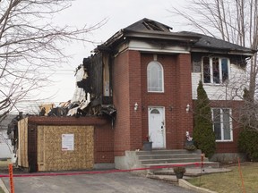 A home on Vallée St. ravaged by fire in the Ste-Anne-de-Bellevue on Nov. 25, 2015. A family lost everything in a fire last week, one month to the day before Christmas.  (John Kenney / MONTREAL GAZETTE)