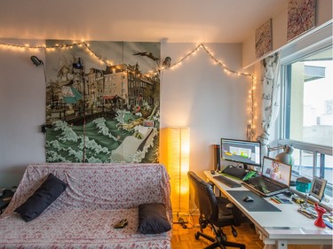 A triptych depicting a street scene from Amsterdam on display in the main living space and office. (Dario Ayala / Montreal Gazette)