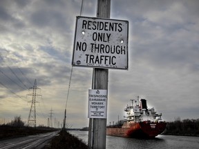 A sign on a road at the edge of Kahnawake, the Mohawk community south of Montreal Thursday December 10, 2015.