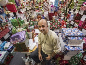 Frank Campanile among thousands of wrapped Christmas gifts he collected for the kids at Batshaw in 2015. He has been collecting and passing out gifts for 31 years and this year will be giving to more than 1,200 kids.