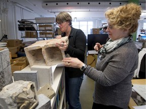 Julia Gersovitz right, looks over a piece of masonry from the F.A.C.E building on rue University  with Nancy Labrecque left, at her office in Montreal on Friday, December 18, 2015. Gersovitz is the conservation architect who is renovating the Parliament Buildings in Ottawa and has restored on many other prominent buildings, including the McGill Arts building and Toronto's Union Station.