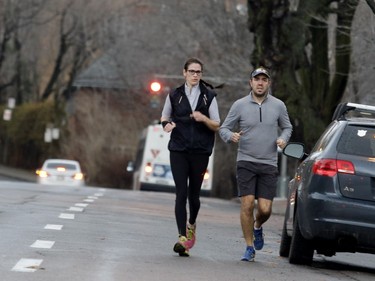 MJ Beaulieu and Jason Malone jog on The Boulevard in Montreal on Thursday December 24, 2015.