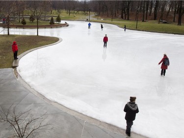People skate on the refrigerated ice surface in Mount Royal Park in Montreal on Thursday December 24, 2015.