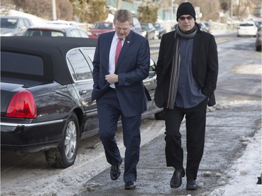 MONTREAL, QUE.: DECEMBER 28, 2015 -- Former Hab Chris Nilan, left, arrives at Mountainside United Church for the funeral of Hab legend Dickie Moore in Montreal, Monday December 28, 2015.  (Vincenzo D'Alto / Montreal Gazette)
