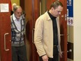 Guy Turcotte, followed by his father, Réal Turcotte, leaves a St-Jérôme courtroom in his double murder trial on the sixth day of deliberation by the jury Saturday, Dec. 5, 2015.