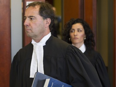 Crown prosecutors René Verret and Maria Albanese leave the courtroom after the guilty verdict of second-degree murder in the trial of Guy Turcotte at the  St. Jérôme courthouse Sunday, Dec. 6, 2015.