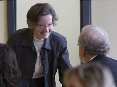 Marguerite Fournier speaks with one of the lawyers on her son Guy Turcotte's legal team in a St. Jérôme courtroom before the verdict in Turcotte's double murder trial in St Jérôme on Sunday, Dec. 6, 2015.