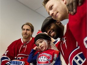 Maxence Gosselin, 4, is the star of the show as he meets Canadiens' Jarred Tinordi, P.K. Subban and Lars Eller during the teams annual holiday visit to the Montreal Children's Hospital in Montreal on Tues., Dec. 8, 2015.
(Allen McInnis / MONTREAL GAZETTE)