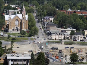 Trucks move about the disaster zone in the town of Lac-Mégantic.  Rebuilding of the town centre continues two years after the train derailment and fire that destroyed it and killed 47 residents.