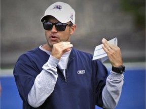Montreal Alouettes defensive coordinator Noel Thorpe signals to his players during practice at Stade Hebert in Montreal Wednesday July 08, 2015.