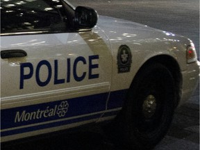 MONTREAL, QUE.: JULY 18, 2012 -- Two police cars remain on scene  outside Notre Dame Basilica in Old Montreal after an armed man was present earlier in the evening  on Wednesday, July 18,  2012. (THE GAZETTE / Tijana Martin) **CROPPED  FOR USE AS GENERIC BREAKING NEWS NIGHT MONTREAL POLICE FILE ART **