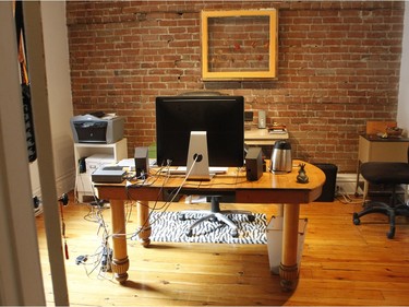 The office with an exposed brick wall.(Marie-France Coallier / MONTREAL GAZETTE)