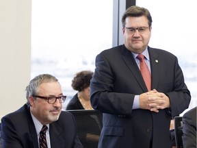 File photo: Denis Coderre, mayor of Montreal, convenes a planning meeting in Montreal on Thursday Nov, 19, 2015. Michel Dorais, left listens in. Dorais has been hired by the city as a consultant and will be paid $1800 per day to co-ordinate Montreal's efforts to welcome Syrian refugees.