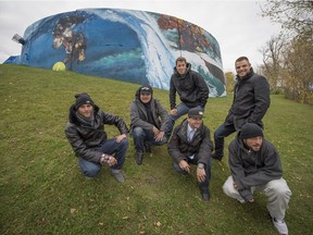 Members of the artists collective A'shop relax at the newly painted Pointe Claire canoe club after a ceremony  unveiling their work  Sunday, October 19, 2014. (Peter McCabe / THE GAZETTE)