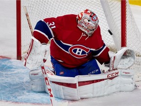 Canadiens' Carey Price makes a save against the Chicago Blackhawks during NHL preseason action in Montreal on Sept. 25, 2015.