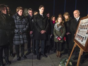 Prime Minister Justin Trudeau takes part in a memorial ceremony on Sunday, Dec. 6, 2015, in Montreal for the 14 women murdered at Ecole Polytechnique on Dec. 6, 1989.