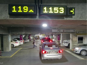 Electronic signs at the parking lot for the MUHC Glen campus indicate where parking spots are available in this file photo.