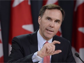 Finance Minister Billl Morneau outlines the Liberal's new tax strategy during a briefing in Ottawa on Monday, Dec. 7, 2015.