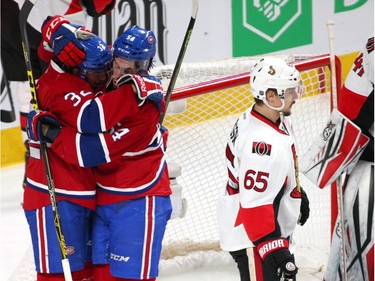 Canadiens right wing Brian Flynn (32) celebrates with left wing Charles Hudon (54) after scoring a goal against the Ottawa Senators during the first period at the Bell Centre.