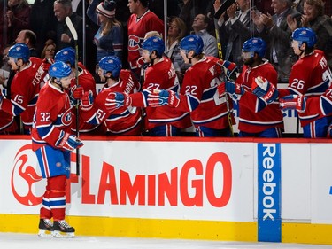 Brian Flynn #32 of the Montreal Canadiens celebrates his goal with the bench during the NHL game against the Ottawa Senators at the Bell Centre on December 12, 2015, in Montreal.