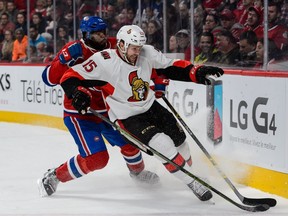 P.K. Subban #76 of the Montreal Canadiens and Zack Smith #15 of the Ottawa Senators chase the puck into the corner during the NHL game at the Bell Centre on December 12, 2015, in Montreal.
