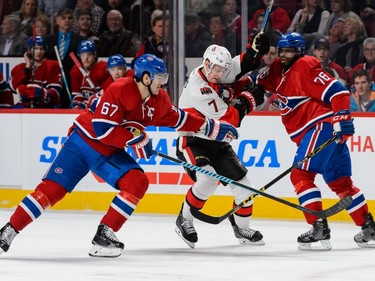 Kyle Turris #7 of the Ottawa Senators tries to skate in-between Max Pacioretty #67 and P.K. Subban #76 of the Montreal Canadiens during the NHL game at the Bell Centre on December 12, 2015, in Montreal.