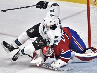 San Jose Sharks' centre Patrick Marleau (12) falls on Montreal Canadiens' goalie Mike Condon (39) during third period NHL hockey action, in Montreal, on Tuesday, Dec. 15, 2015.