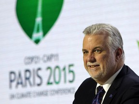 Quebec Premier Philippe Couillard, attends a signing ceremony at the COP21, the United Nations Climate Change Conference Monday, Dec. 7, 2015 in Le Bourget, north of Paris. The Paris conference is the 21st time world governments are meeting to seek a joint solution to climate change. The talks are focused on reducing emissions of carbon dioxide and other greenhouse gases, primarily by shifting from oil, coal and gas to cleaner sources of energy.
