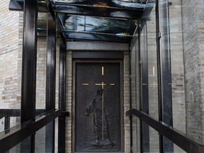 The Holy Door at the Cathedral-Basilica Notre-Dame de Québec in Quebec City on Saturday Dec. 26, 2015. The massive bronze door embossed with biblical figures was a gift from the Vatican in 2013 to celebrate the 350th anniversary of the Cathedral-Basilica Notre-Dame de Quebec, the oldest church in North America.