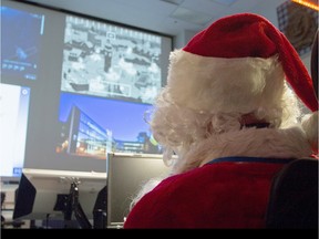 Santa Claus attends a pre-flight operational briefing by the by the Canadian NORAD Region (CANR).