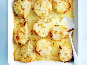 Season onions and bake under a topping of cheese for an easy supper or buffet dish.