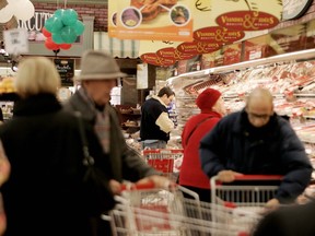 Shoppers crowd the rows of a Montreal grocery store on Côte-des-Neiges Rd.