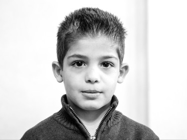 Syrian refugee Obada, 7, from Kherbet Ghazala, Syria is seen Monday, November 30, 2015 in Irbid, Jordan. His family is waiting for final approval to immigrate to Canada.