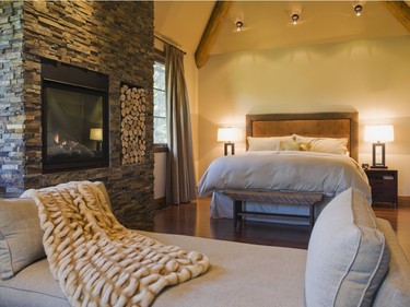 The new master bedroom with its vaulted ceiling, includes a daybed and a gas fireplace. (Photo by Perry Mastrovito)