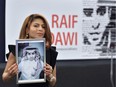 Ensaf Haidar  holds a picture of her husband, Raif Badawi, after accepting the European Parliament's Sakharov human rights prize on behalf of her husband, at the European Parliament in Strasbourg, eastern France, on December 16, 2015.