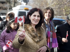 Syrian refugee Manushian Karageosian arrives at the Armenian Community Centre in North York Toronto on Friday.