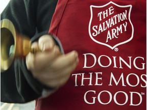 A Salvation Army volunteer solicits donations.